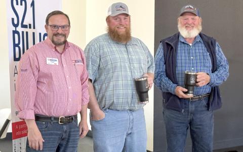 MNJ Photo/Jaren Gragg.  From left, County Extension Director Brandon Pitman poses with Terry and George Moffitt of Tater Hill Farm.