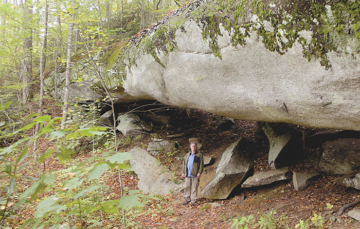 Gary Wein, with the Highlands-Cashiers Land Trust shows the second longest natural land bridge east of the Mississippi River, a 147-foot long natural land bridge spanning the side of a mountain in the Scaly Mountain community.