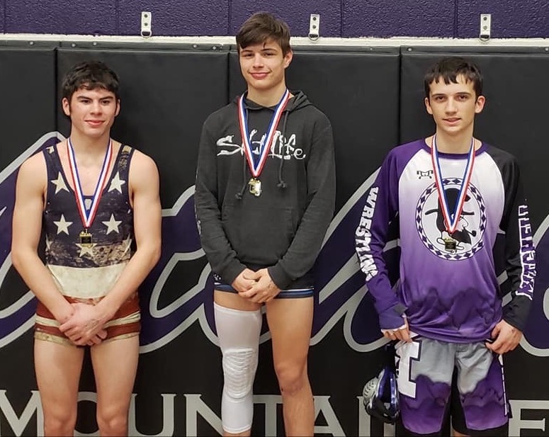 Mitchell senior Elijah Smith, right, earned a second-place finish in the 126-pound weight class at the Western highlands Conference Tournament. (Submitted)