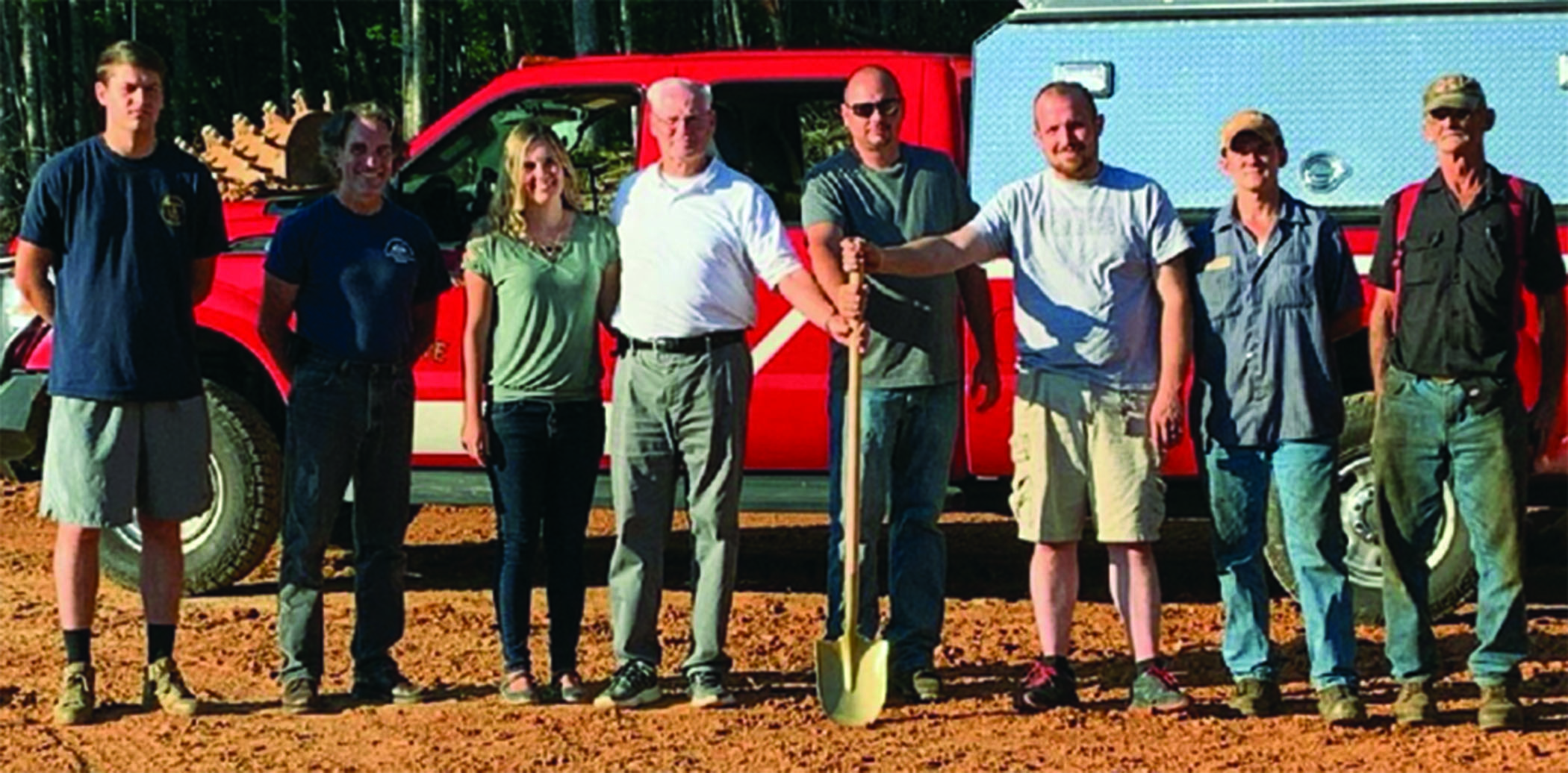 Volunteers pose for a photo. before beginning work on a new substation for the rural Rhododendron Fire District. Bakersville Fire and Rescue started construction on the substation earlier this month. The substation will allow the department to provide continued protection to the Bandana community. (Photo submitted)