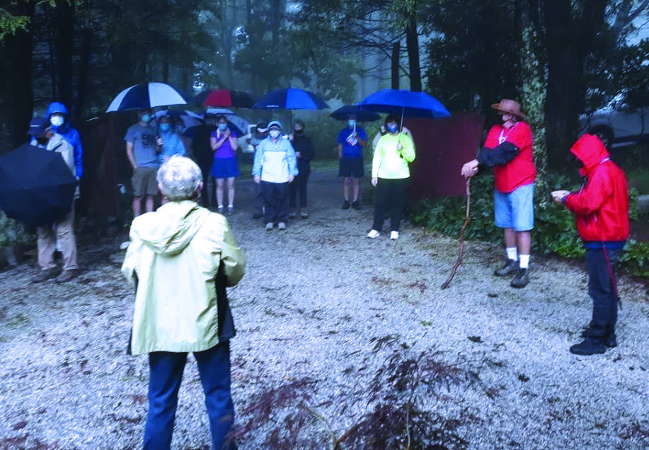 Walkers in Little Switzerland utilize their rain coats and umbrellas to meet on the morning of Saturday, Sept. 12 before beginning the local “Walk Their Way” to defeat ALS. In Little Switzerland, 20 masked walkers braved the dreary conditions to join nearly 4,000 walkers across North Carolina who were also walking to raise awareness and funds for ALS. (Submitted photo)