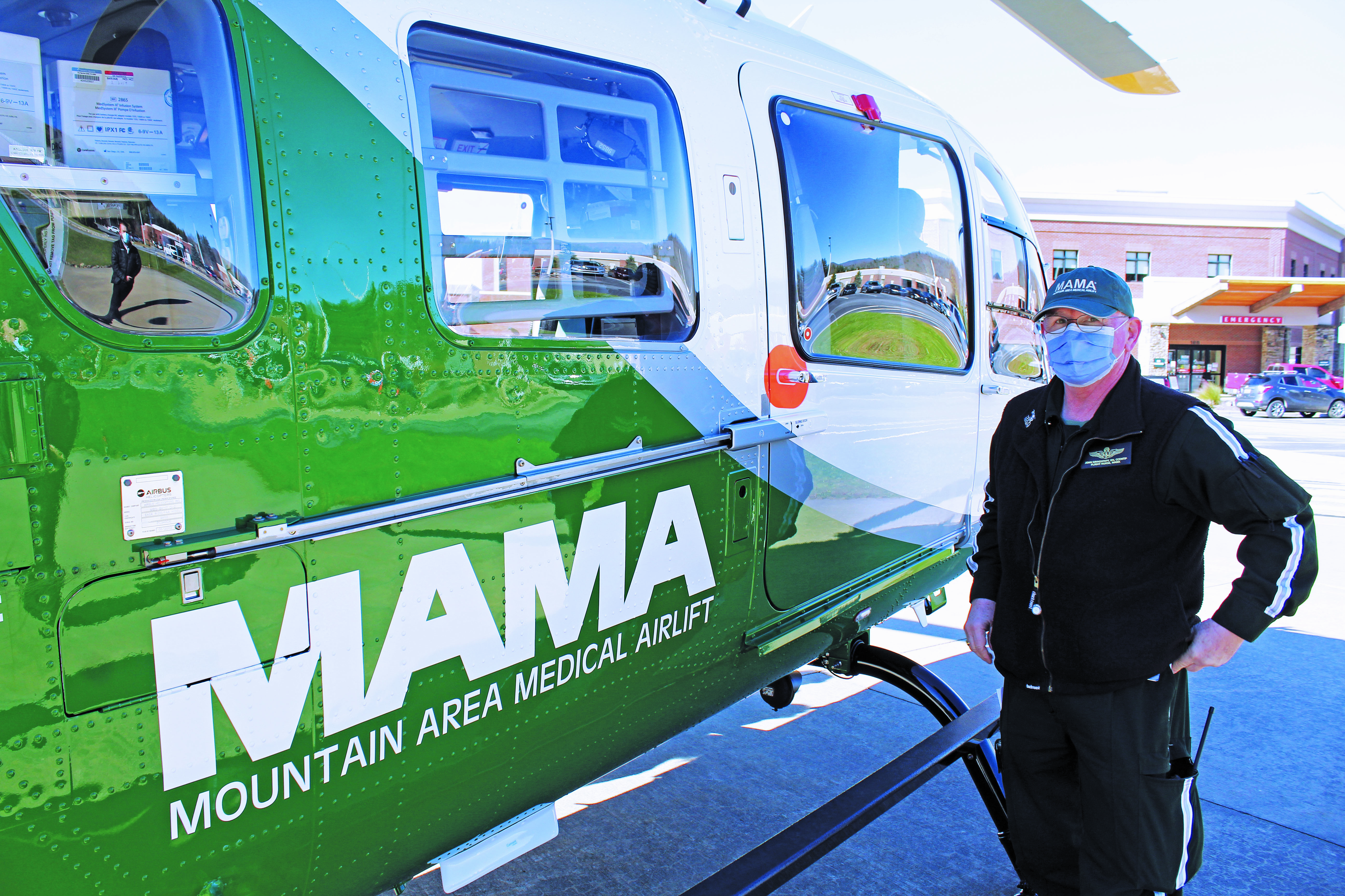 Mountain Area Medical Airlift (MAMA) Supervisor John Grindstaff stands next to the new aircraft and talks about the benefits it will bring to Mission Health and the local communities it serves. (MNJ photo/Cory Spiers)