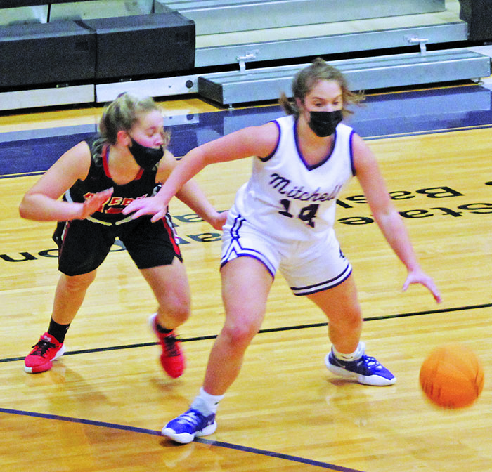 Junior guard Chloe Carter works her way around an Avery defender on Friday, Jan. 29. Carter scored five points and added two assists as she helped the Mountaineers rout Avery 65-33. Mitchell moved to 8-0 on the season with the win over the Vikings. (MNJ photo/Cory Spiers)