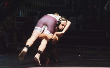 MCS Photo/ Maygon Styles - Senior Jayden Burleson secures the take down in a recent match against Swain. 