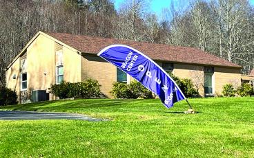 Photo submitted - The Beacon Center operates inside of the Fellowship Hall of the Spruce Pine United Methodist Church. A distinctive purple banner is displayed during nights of operation.