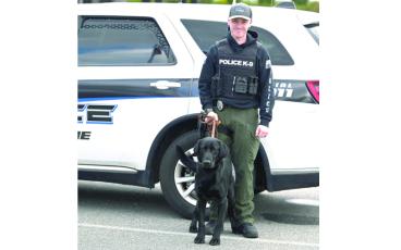 MNJ photo/Sarah Quintas. SPPD Officer Dalton Mace with Thor, the newest member of the SPPD. 